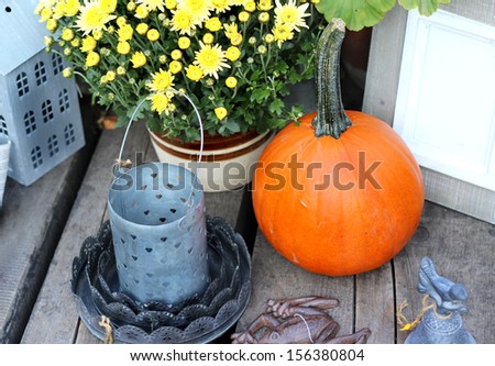 Halloween decorations with pumpkin and other decor objects