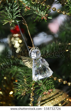 Beautiful Christmas tree decorated with crystal angel toy