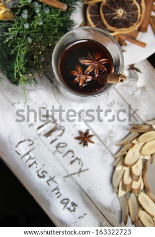 Traditional Christmas punch, dried oranges, wreath, cinnamon and anise