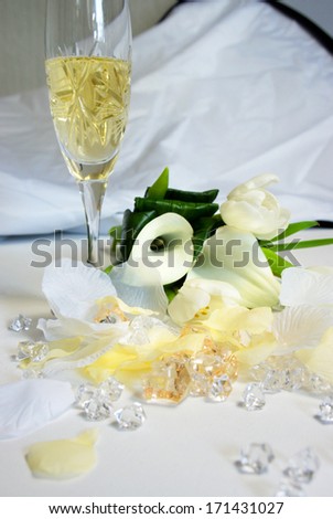 Beautiful wedding bouquet of white callas and tulips lying on the table