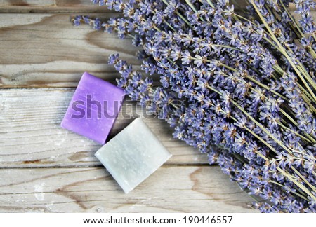 Mix of lavender flowers and cosmetic on the wooden background