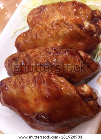 fried chicken wing with teriyaki sauce , japanese food