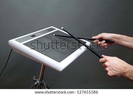 male hands playing percussion pad