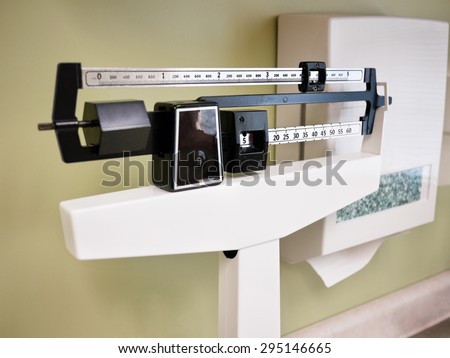Physician Beam Scale - Medical processional sliding balance weight scale at a doctor\'s office