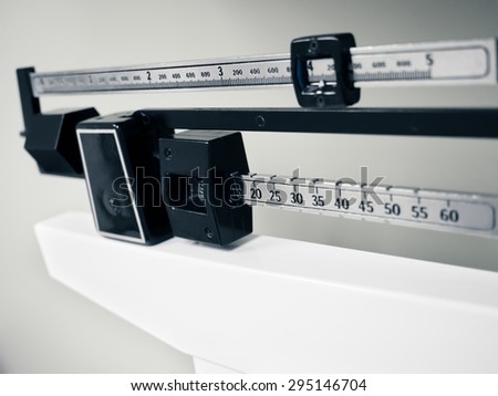 Doctor's Office Scale - Medical professional physician sliding balance weight scale at a doctor's office