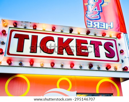 Photo of carnival tickets sign on a ticket stand. Commonly seen  at carnivals, state fairs, county fairs,  amusement parks, fesitvals, and other summer events.