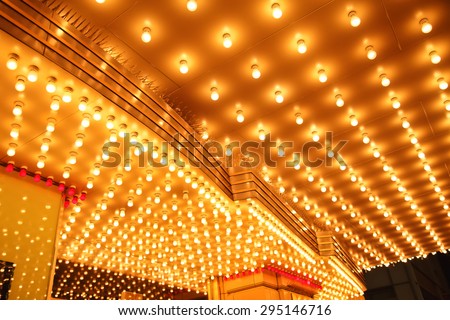 Theatre Marquee Lights - Picture of rows of theater marquee lights on the ceiling of an old theater entrance