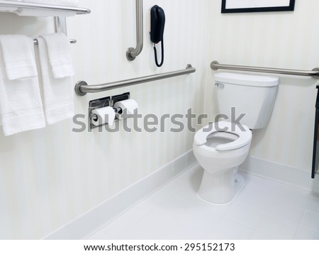 Handicapped access bathroom with grab bars and a toilet