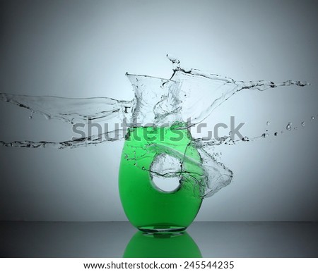 water splashing on a mug of soda