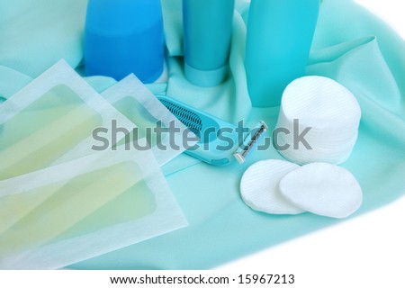 Household items for cleanliness and hair-removing on a satin background