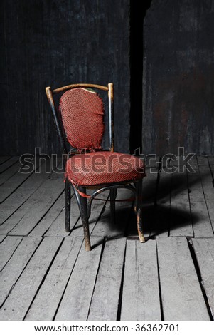 Old fashioned chair on wooden floor