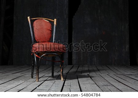 Old fashioned chair on wooden floor