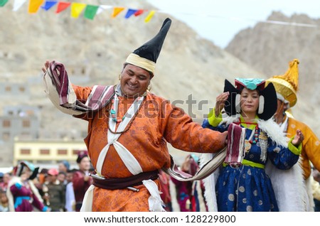 LEH, LADAKH, INDIA - SEPTEMBER 08: Artists in traditional tibetan costumes performing folk dance. Last day of Annual Festival of Ladakh Heritage in Leh, India. September 08, 2012.