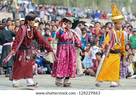 LEH, LADAKH, INDIA - SEPTEMBER 08: Artists in historical tibetan costumes performing folk dance. Last day of Annual Festival of Ladakh Heritage in Leh, India. September 08, 2012.