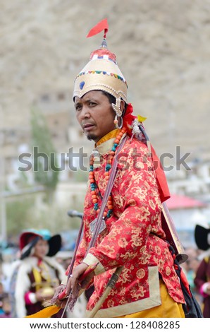 LEH, LADAKH, INDIA - SEPTEMBER 08, 2012: Artist in traditional costumes performing folk dance in praise of king of Ladakh. Annual Festival of Ladakh Heritage in Leh, India. September 08, 2012.