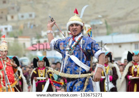LEH, LADAKH, INDIA - SEPTEMBER 08: Artist in traditional tibetan costumes performing folk dance in praise of king of Ladakh. Annual Festival of Ladakh Heritage in Leh, India. September 08, 2012.