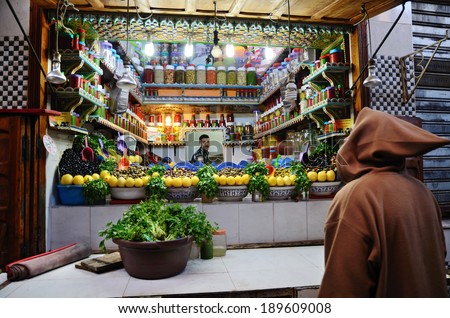 Fez, Morocco - March 5, 2014: Men selling colored olives in a street  market in Fez, Morocco