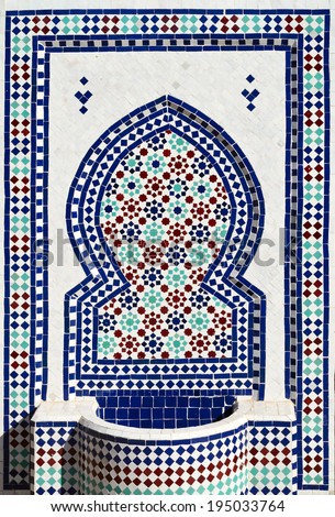 Colorful mosaic on typical moroccan fountain in medina of Meknes, Morocco.
