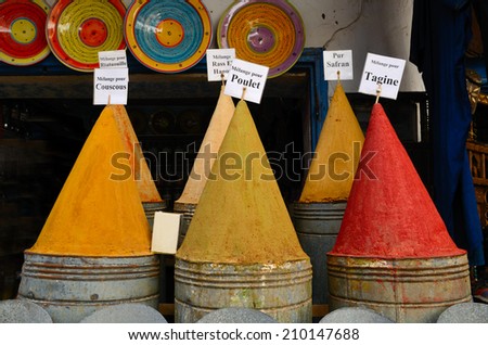 Colorful piles of powdered spices in moroccan spice market in medina of Fes, Morocco