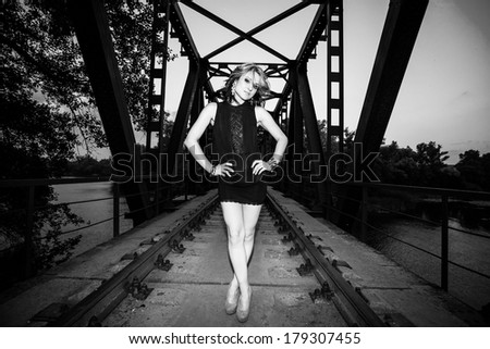 portrait of beautiful young woman with wine glass, black and white retro stylization