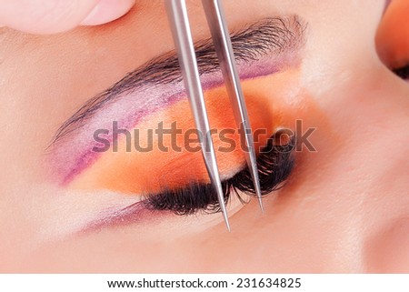 Woman eye with long eyelashes. Eyelash extension.Beautiful young woman eyelash extension
