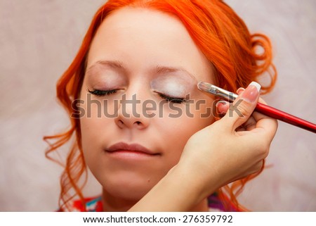 bridal make-up. beautiful bride in white wedding dress with hairstyle and bright makeup. Happy sexy girl waiting for groom.
