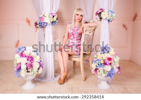 Gorgeous Blonde Woman with retro hairstyle and makeup in luxury interior, elegant sexy girl with wedding makeup in vintage style.
