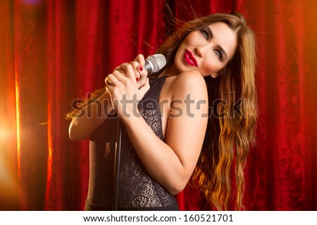 A beautiful young singer performing on stage