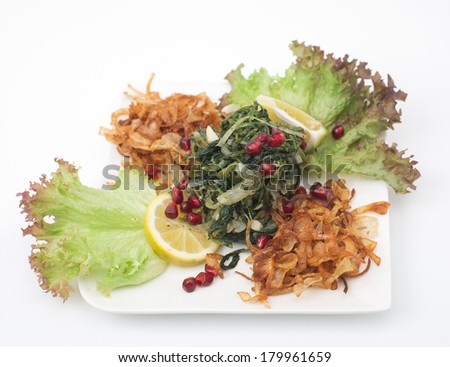 lebanese food of Cooked hindbh with fried onion and lemon
