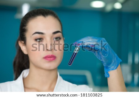Female doctor diagnosing a chemical in lab