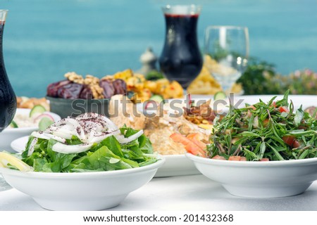 Lebanese food presentation of rucola, thyme Salad, and Jalleb served in Ramadan.