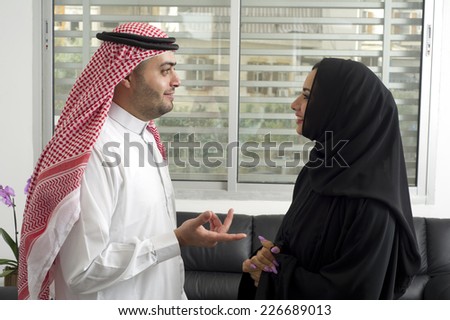 Arabian Business man having a discussion with an arabian businesswoman in the office
