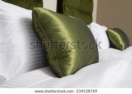 Cushions , Green pillows on bed