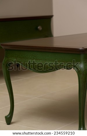 Close-up of a luxurious table corner , vintage solid wood furniture detail
