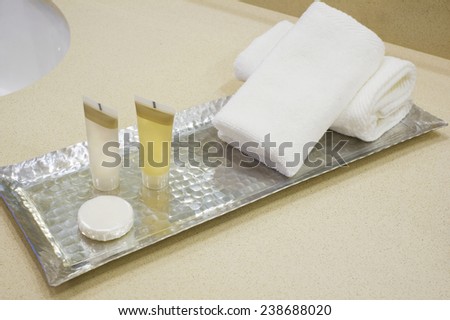 Shower set at hotel, A bar of  soap, with hand towels and wash cloths, shampoo and body lotion