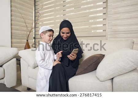 Arabian family, Arabian mom and son using Mobile phone