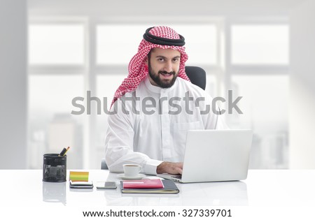 Arabian business man working on Laptop in the office