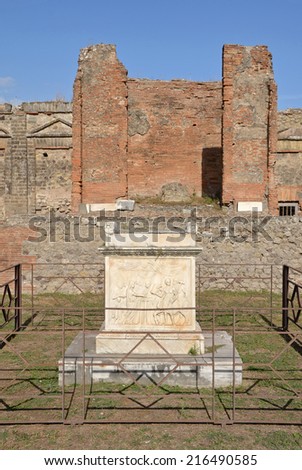Altar in Temple of Vespasian, Pompeii, Italy. Behind the altar is the eastern wall with cella and podium.