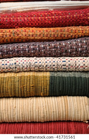 stack of colorful hand-woven fabrics