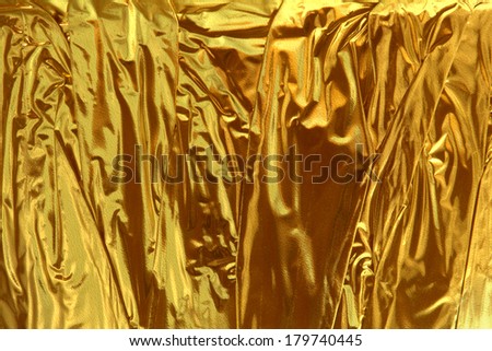 Gold metallic shimmering foil abstract