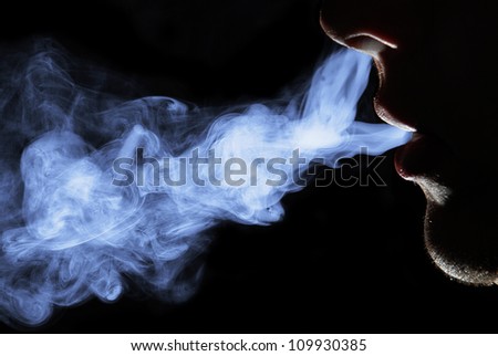 Smoking man. Black background