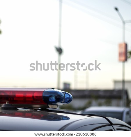 closeup of police cop officer law emergency service car siren