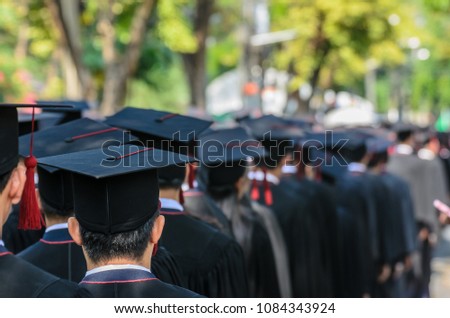 The shot of graduation hats and the back of graduates during commencement success graduates of the university in the Graduation Ceremony. Concept education congratulation of graduates in University.