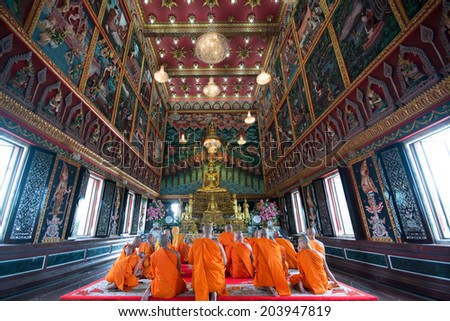 SAMUTPRAKARN, THAILAND - October 19: Unidentified thai monks praying in Buddha Holy Day on October 19, 2013 At Wat Banguasuea, SAMUTPRAKARN, THAILAND
