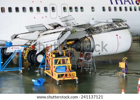 Bangkok Thailand - July 23, 2014: Aircraft Engineer during maintenance in Thai Airways at Suvarnabhumi Airport