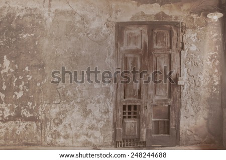 Ancient door with old wall texture at Fire Station in Bangkok, Thailand