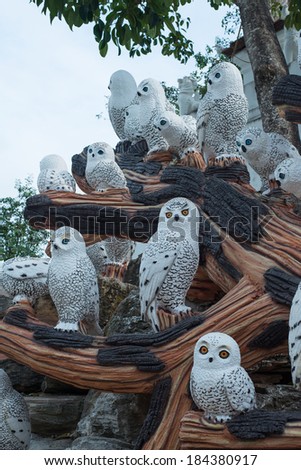PATTAYA, THAILAND - FEBUARY 15: Owl statues on the artificial trees at Nong Nooch Garden, on FEBUARY 15, 2014 in Pattay.
