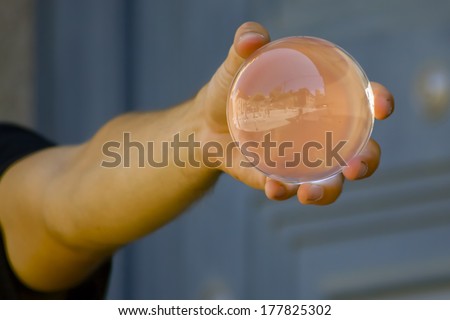 hands holding a magic crystal ball