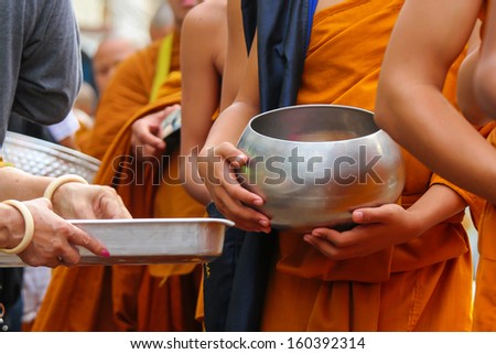 Monk Mass Alms Giving in Nongkhai, Thailand. Thailand merit to the early days of Buddhist monks. At Nongkhai City, North East of Thailand.