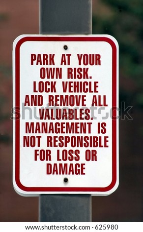 Park at own risk sign